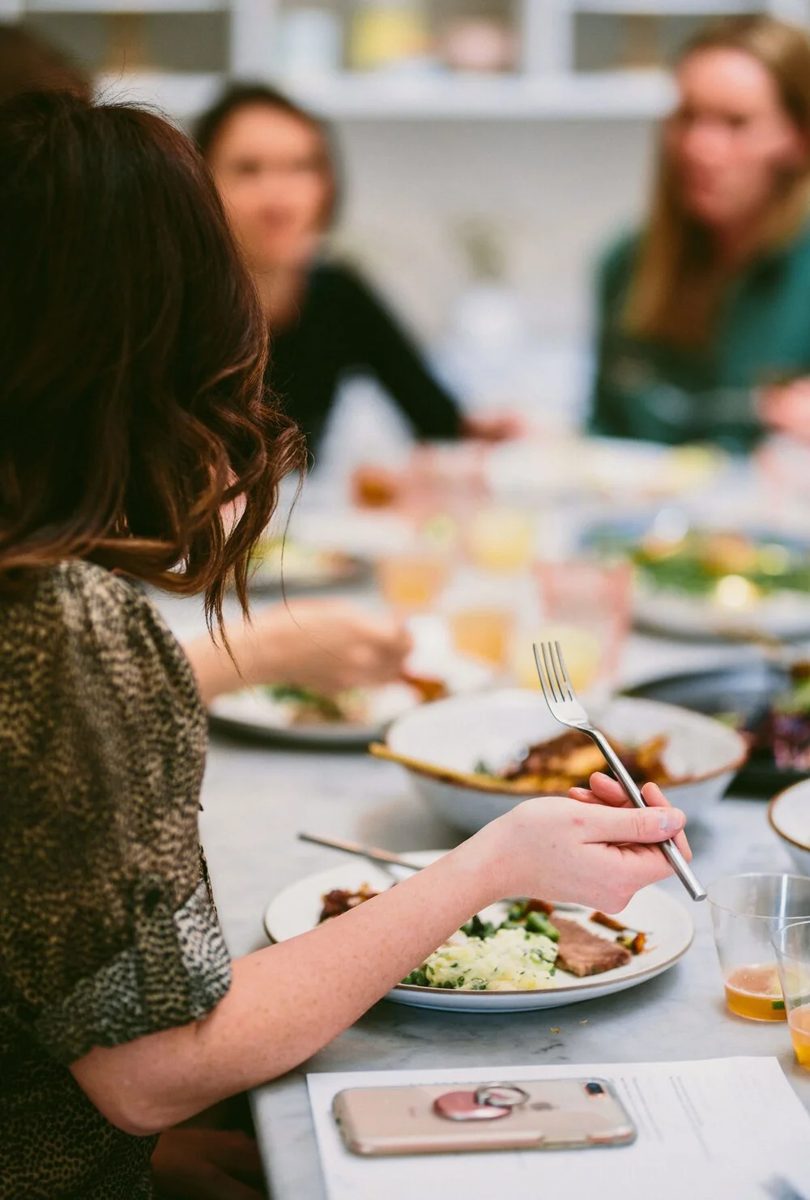Guests in the Urban Palate tasting room enjoying cuisine by Jonathan Bailey